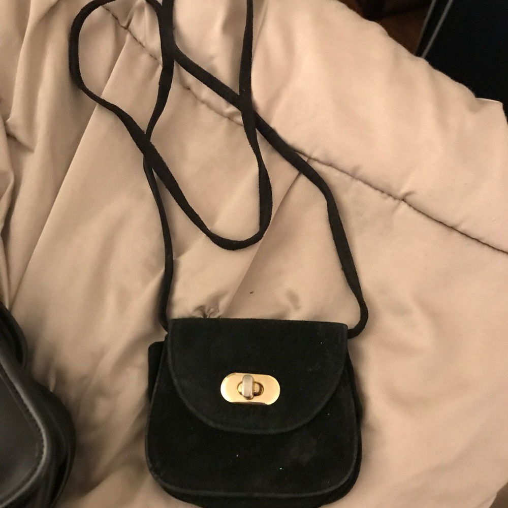 Stylish Black Crossbody Bag with Gold Accent
